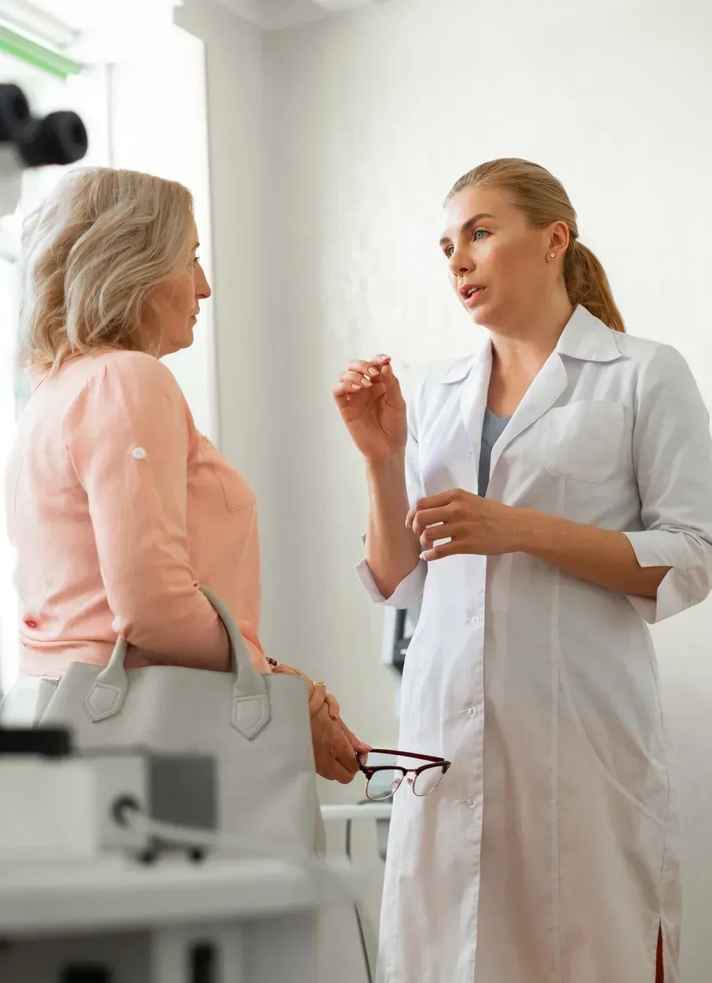 Aesthetic nurse practitioner discussing treatment options with patient during consultation